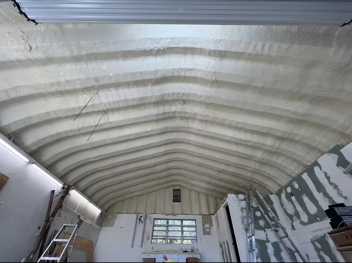 Spray polyurethane foam applied to the underside of a metal roof deck in Cudahy